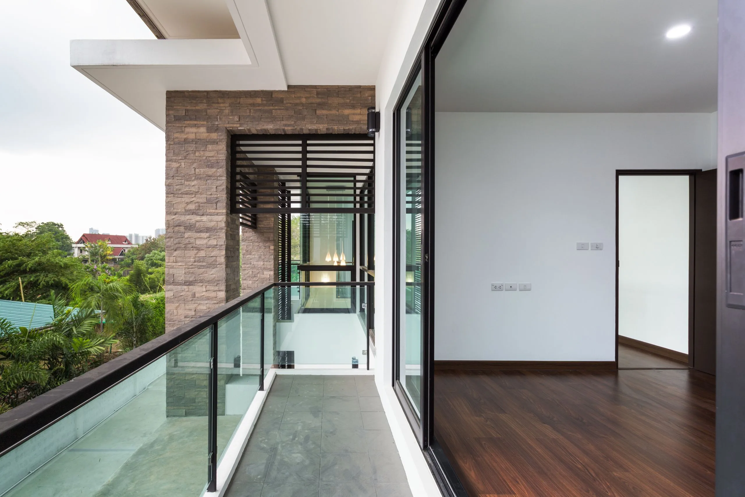 Residential balcony with sliding glass door.